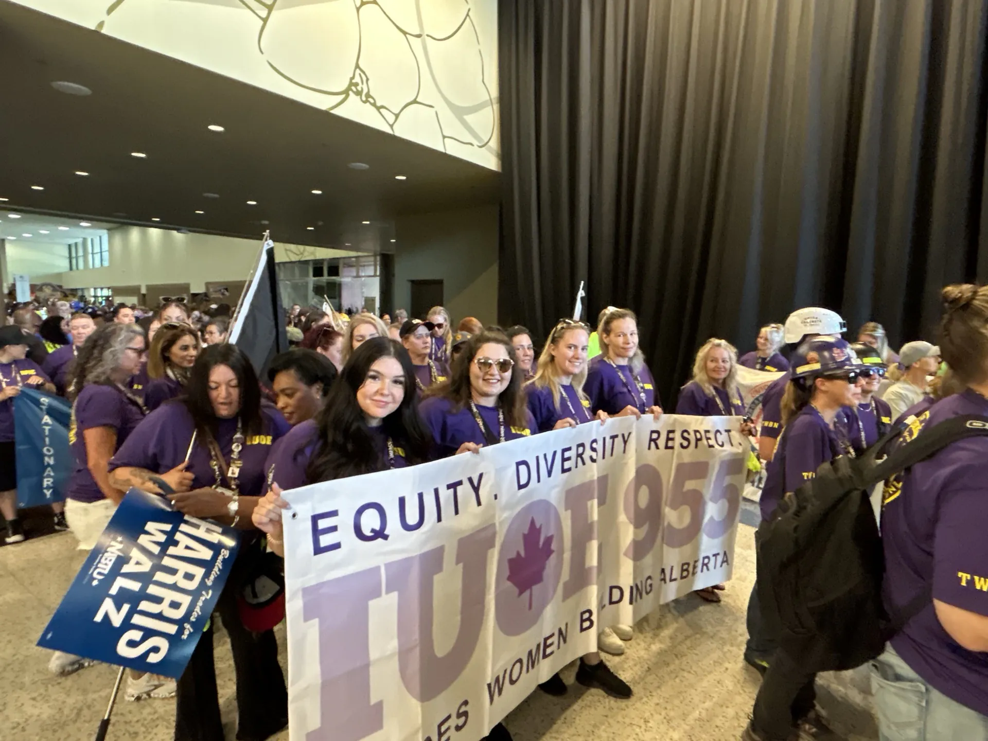IUOE Local 955 tradeswomen holding an Equity Diversity Respect banner at a union event